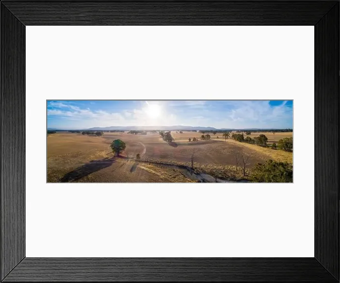 Framed Print : Wide aerial panoramic landscape of Australian outback at sunset with lens flare Framed Print : Wide aerial panoramic landscape of Australian outback at sunset with lens flare