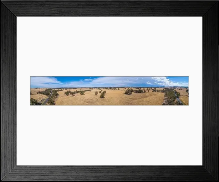 Framed Print : Wide aerial panorama of yellow grasslands and scattered trees in Victoria, Australia Framed Print : Wide aerial panorama of yellow grasslands and scattered trees in Victoria, Australia