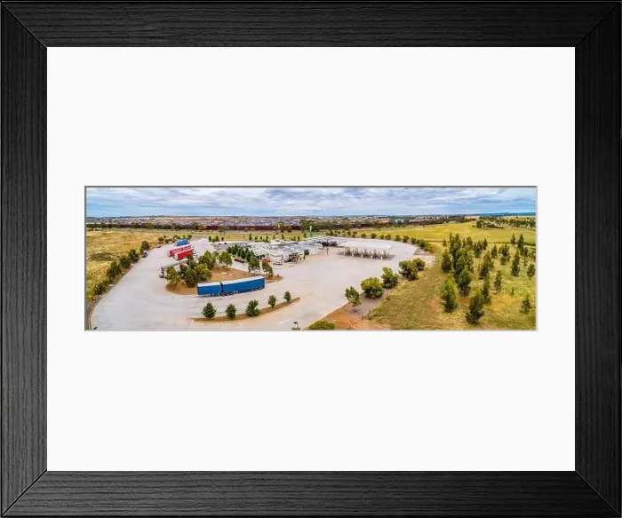 Framed Print : Melbourne, Australia - Circa January 2020: Trucks parked at truck stop on Western Freeway - aerial panorama Framed Print : Melbourne, Australia - Circa January 2020: Trucks parked at truck stop on Western Freeway - aerial panorama