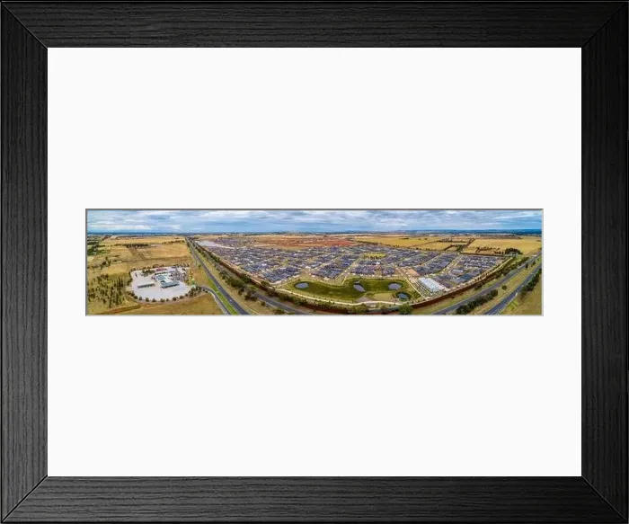 Framed Print : Melbourne, Australia - Circa January 2020: Wide aerial panorama of Rockbank suburb near the Western Freeway Framed Print : Melbourne, Australia - Circa January 2020: Wide aerial panorama of Rockbank suburb near the Western Freeway