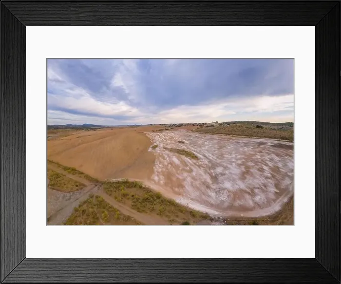Framed Print : Drone aerial panorama of a desert like hill landscape with marble stones dust at sunset in Terena, Portugal