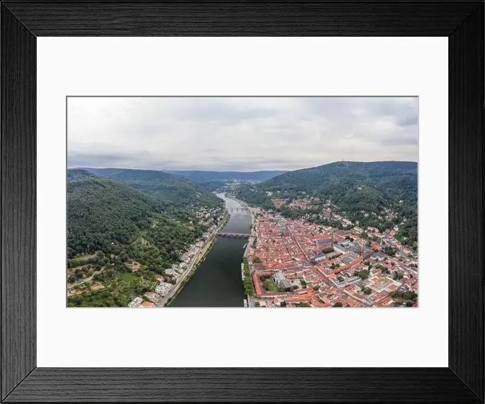 Framed Print : Aerial drone shot of Heidelberg old town in overcast at foot of Konigstuhl mountain Framed Print : Aerial drone shot of Heidelberg old town in overcast at foot of Konigstuhl mountain