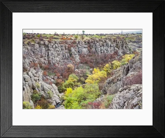 Framed Print : Aktovsky Canyon, Ukraine. Autumn trees and large stone boulders around Framed Print : Aktovsky Canyon, Ukraine. Autumn trees and large stone boulders around