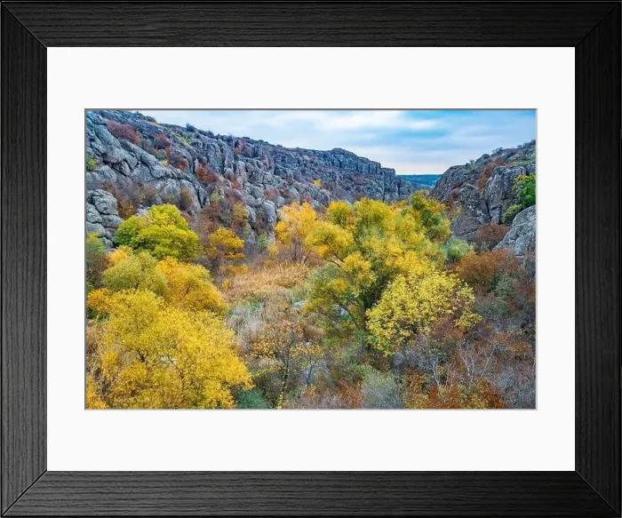 Framed Print : Aktovsky Canyon, Ukraine. Autumn trees and large stone boulders around Framed Print : Aktovsky Canyon, Ukraine. Autumn trees and large stone boulders around
