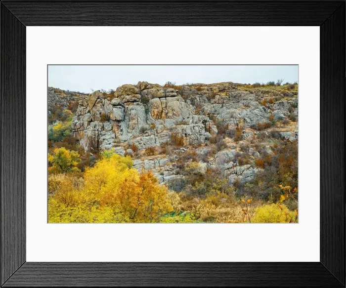 Framed Print : Aktovsky Canyon, Ukraine. Autumn trees and large stone boulders around Framed Print : Aktovsky Canyon, Ukraine. Autumn trees and large stone boulders around