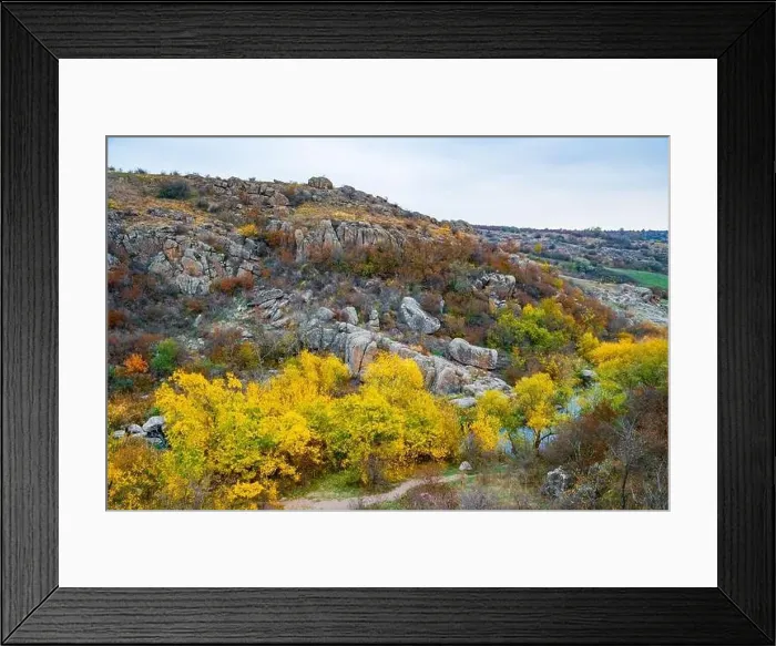 Framed Print : Aktovsky Canyon, Ukraine. Autumn trees and large stone boulders around Framed Print : Aktovsky Canyon, Ukraine. Autumn trees and large stone boulders around