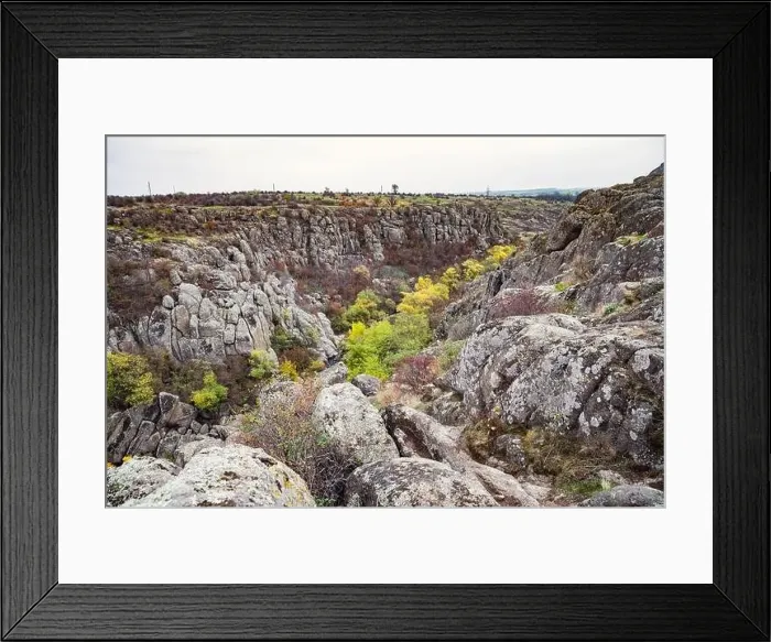 Framed Print : Aktovsky Canyon, Ukraine. Autumn trees and large stone boulders around Framed Print : Aktovsky Canyon, Ukraine. Autumn trees and large stone boulders around