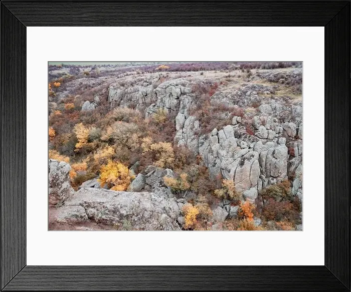 Framed Print : Aktovsky Canyon, Ukraine. Autumn trees and large stone boulders around Framed Print : Aktovsky Canyon, Ukraine. Autumn trees and large stone boulders around