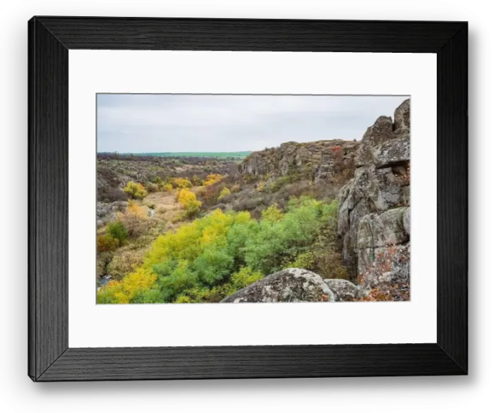 Framed Print : Aktovsky Canyon, Ukraine. Autumn trees and large stone boulders around Framed Print : Aktovsky Canyon, Ukraine. Autumn trees and large stone boulders around