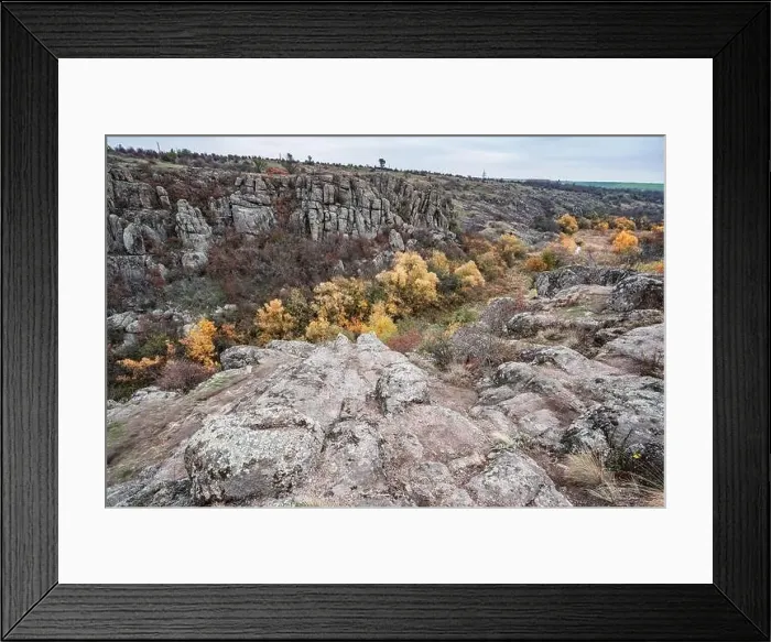 Framed Print : Aktovsky Canyon, Ukraine. Autumn trees and large stone boulders around Framed Print : Aktovsky Canyon, Ukraine. Autumn trees and large stone boulders around