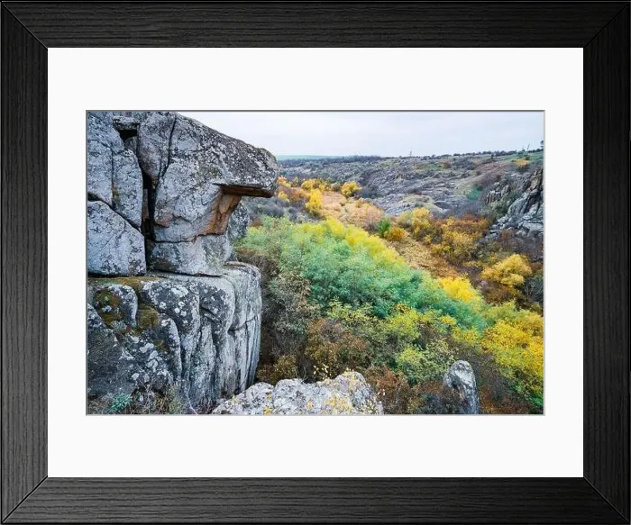 Framed Print : Aktovsky Canyon, Ukraine. Autumn trees and large stone boulders around Framed Print : Aktovsky Canyon, Ukraine. Autumn trees and large stone boulders around