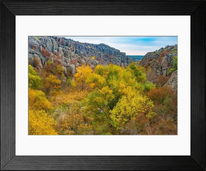 Framed Print : Aktovsky Canyon, Ukraine. Autumn trees and large stone boulders around Framed Print : Aktovsky Canyon, Ukraine. Autumn trees and large stone boulders around