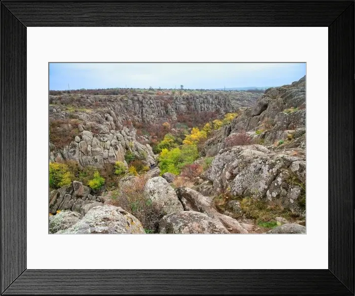Framed Print : Aktovsky Canyon, Ukraine. Autumn trees and large stone boulders around Framed Print : Aktovsky Canyon, Ukraine. Autumn trees and large stone boulders around