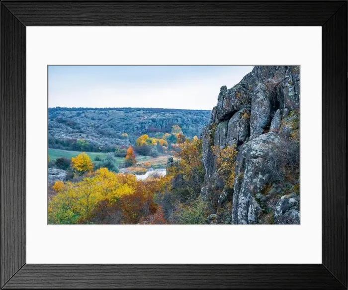 Framed Print : Aktovsky Canyon, Ukraine. Autumn trees and large stone boulders around Framed Print : Aktovsky Canyon, Ukraine. Autumn trees and large stone boulders around