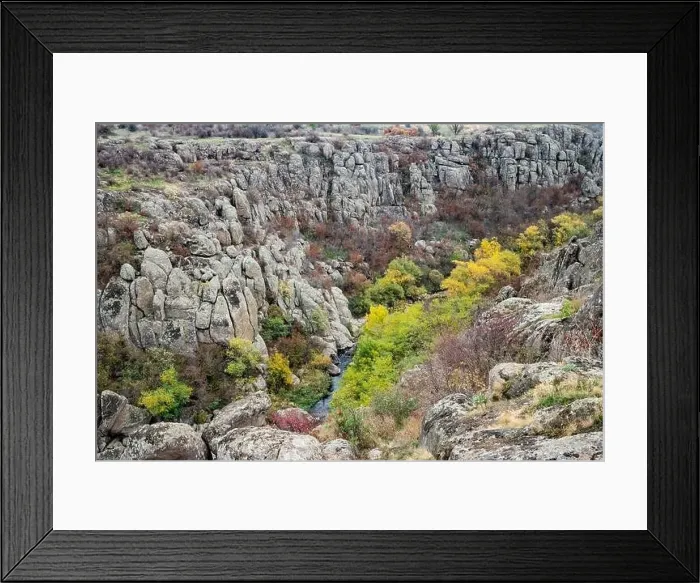 Framed Print : Aktovsky Canyon, Ukraine. Autumn trees and large stone boulders around Framed Print : Aktovsky Canyon, Ukraine. Autumn trees and large stone boulders around