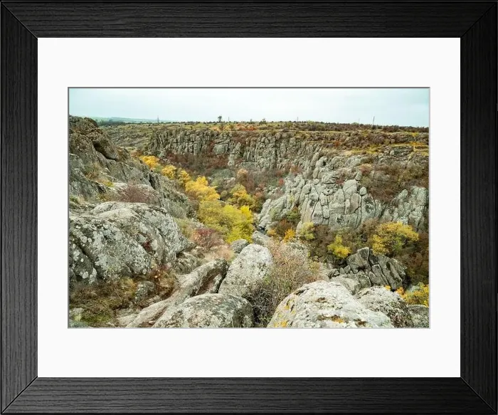 Framed Print : Aktovsky Canyon, Ukraine. Autumn trees and large stone boulders around Framed Print : Aktovsky Canyon, Ukraine. Autumn trees and large stone boulders around