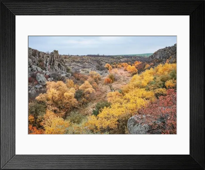 Framed Print : Aktovsky Canyon, Ukraine. Autumn trees and large stone boulders around Framed Print : Aktovsky Canyon, Ukraine. Autumn trees and large stone boulders around