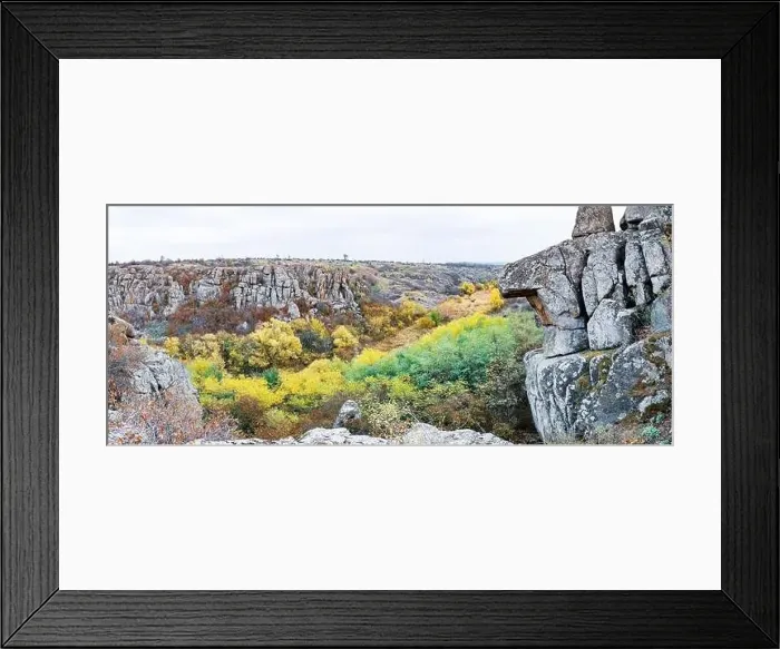 Framed Print : Aktovsky Canyon, Ukraine. Autumn trees and large stone boulders around Framed Print : Aktovsky Canyon, Ukraine. Autumn trees and large stone boulders around