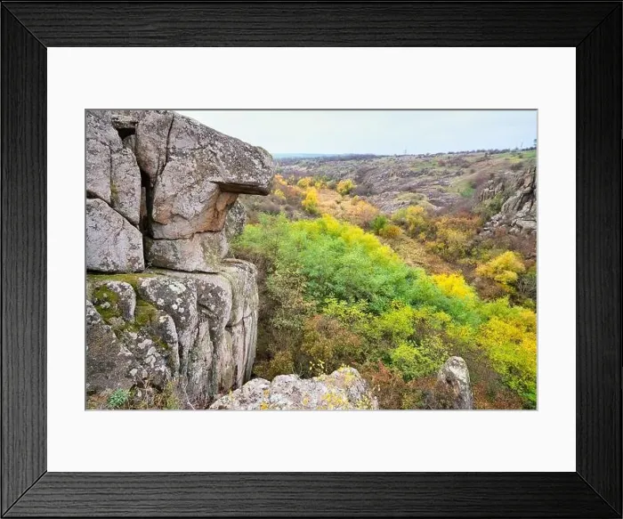 Framed Print : Aktovsky Canyon, Ukraine. Autumn trees and large stone boulders around Framed Print : Aktovsky Canyon, Ukraine. Autumn trees and large stone boulders around