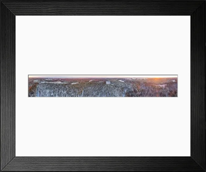 Framed Print : Snow covered winter forest view from drone during sunrise Framed Print : Snow covered winter forest view from drone during sunrise
