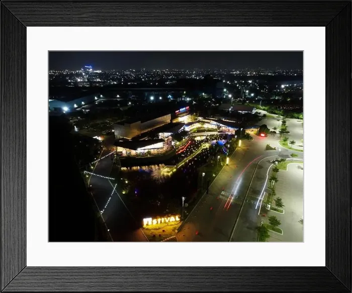 Framed Print : Aerial drone view of modern building in Jakarta central business district at night with Jakarta cityscape Framed Print : Aerial drone view of modern building in Jakarta central business district at night with Jakarta cityscape