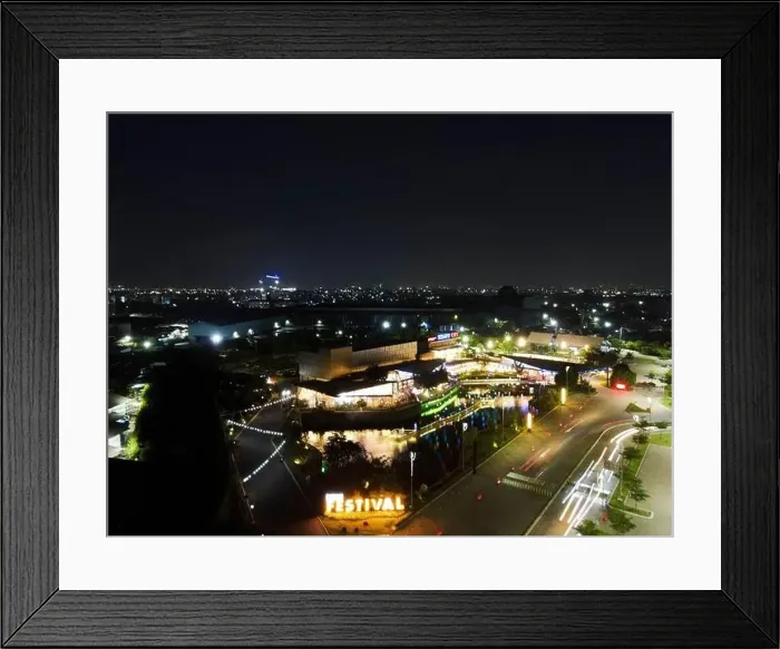 Framed Print : Aerial drone view of modern building in Jakarta central business district at night with Jakarta cityscape Framed Print : Aerial drone view of modern building in Jakarta central business district at night with Jakarta cityscape