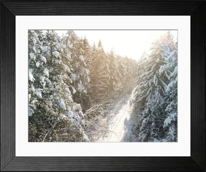 Framed Print : photo from a flying drone, a small planet and a winter landscape, pines and spruces are covered with snow Framed Print : photo from a flying drone, a small planet and a winter landscape, pines and spruces are covered with snow