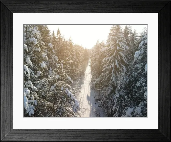 Framed Print : photo from a flying drone, a small planet and a winter landscape, pines and spruces are covered with snow Framed Print : photo from a flying drone, a small planet and a winter landscape, pines and spruces are covered with snow