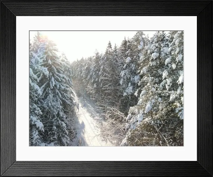 Framed Print : photo from a flying drone, a small planet and a winter landscape, pines and spruces are covered with snow Framed Print : photo from a flying drone, a small planet and a winter landscape, pines and spruces are covered with snow