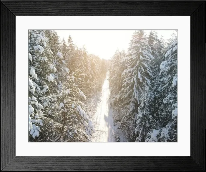 Framed Print : photo from a flying drone, a small planet and a winter landscape, pines and spruces are covered with snow Framed Print : photo from a flying drone, a small planet and a winter landscape, pines and spruces are covered with snow