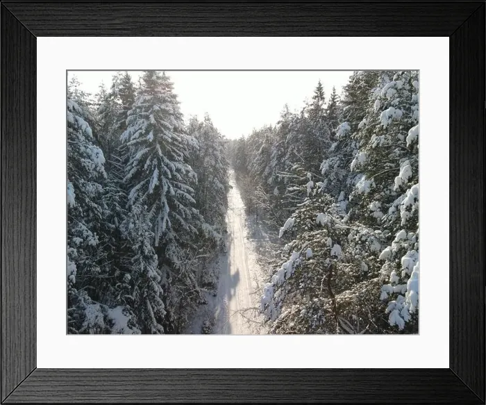 Framed Print : photo from a flying drone, a small planet and a winter landscape, pines and spruces are covered with snow Framed Print : photo from a flying drone, a small planet and a winter landscape, pines and spruces are covered with snow