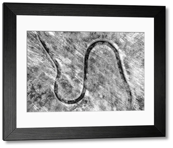 Framed Print : Cars on road in winter with snow covered trees aerial view at a double curve - wonderful snowy drone photography Framed Print : Cars on road in winter with snow covered trees aerial view at a double curve - wonderful snowy drone photography