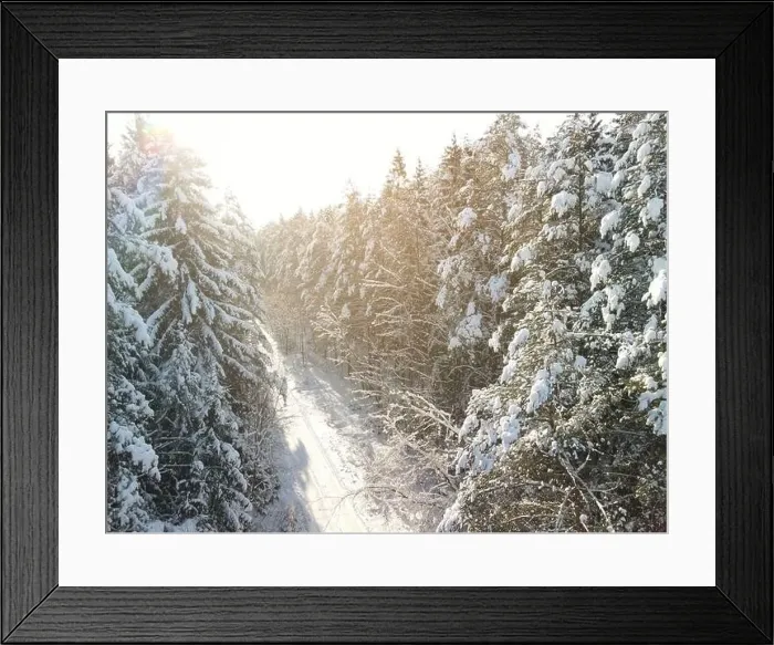 Framed Print : photo from a flying drone, a small planet and a winter landscape, pines and spruces are covered with snow Framed Print : photo from a flying drone, a small planet and a winter landscape, pines and spruces are covered with snow