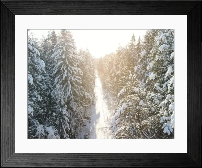 Framed Print : photo from a flying drone, a small planet and a winter landscape, pines and spruces are covered with snow Framed Print : photo from a flying drone, a small planet and a winter landscape, pines and spruces are covered with snow