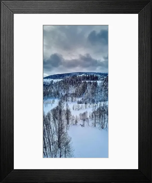 Framed Print : Beautiful panoramic aerial drone view on a winter landscape in the Stolowe mountains during a snowfall Framed Print : Beautiful panoramic aerial drone view on a winter landscape in the Stolowe mountains during a snowfall