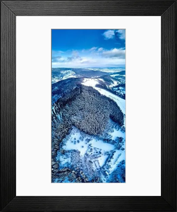 Framed Print : Beautiful panoramic aerial drone view on a winter landscape in the Stolowe mountains during a snowfall Framed Print : Beautiful panoramic aerial drone view on a winter landscape in the Stolowe mountains during a snowfall