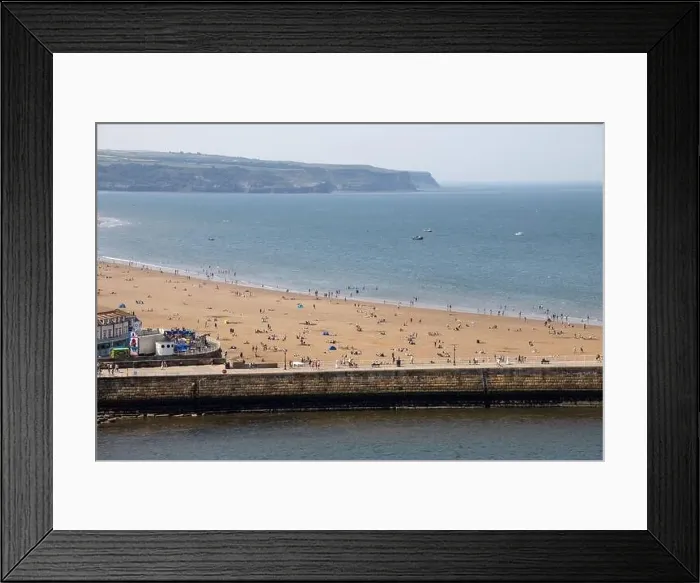Framed Print : Aerial photo of the beautiful town of Whitby in the UK in North Yorkshire in the UK showing people on the sandy beach Framed Print : Aerial photo of the beautiful town of Whitby in the UK in North Yorkshire in the UK showing people on the sandy beach