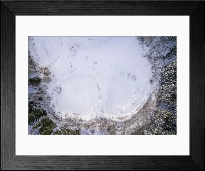 Framed Print : Aerial view of snow covered forest around beautiful lake Framed Print : Aerial view of snow covered forest around beautiful lake