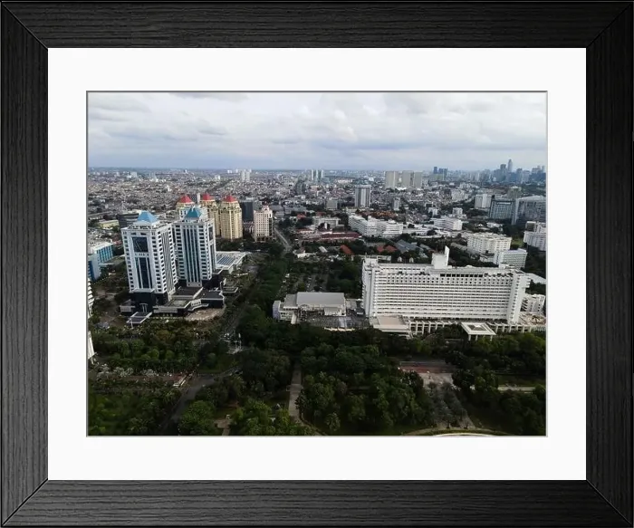 Framed Print : Aerial view of highway intersection and buildings in the city of Jakarta and noise cloud with Jakarta cityscape Framed Print : Aerial view of highway intersection and buildings in the city of Jakarta and noise cloud with Jakarta cityscape