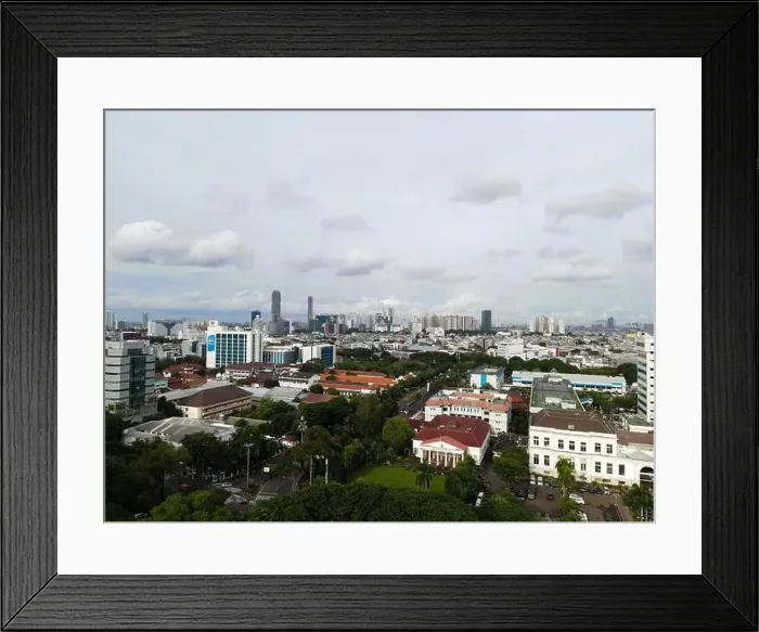Framed Print : Aerial view of highway intersection and buildings in the city of Jakarta and noise cloud with Jakarta cityscape Framed Print : Aerial view of highway intersection and buildings in the city of Jakarta and noise cloud with Jakarta cityscape