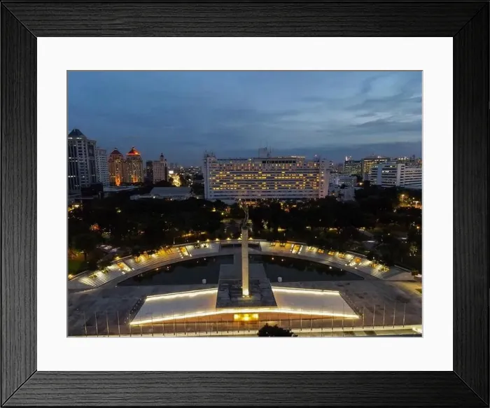 Framed Print : Aerial view of West Irian Liberation monument in downtown Jakarta and noise cloud when sunset with Jakarta cityscape