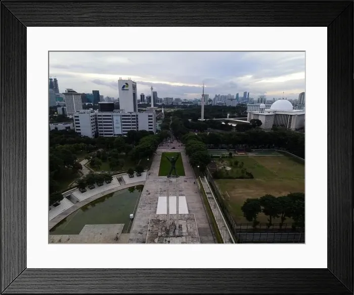 Framed Print : Aerial view of West Irian Liberation monument in downtown Jakarta and noise cloud with Jakarta cityscape Framed Print : Aerial view of West Irian Liberation monument in downtown Jakarta and noise cloud with Jakarta cityscape