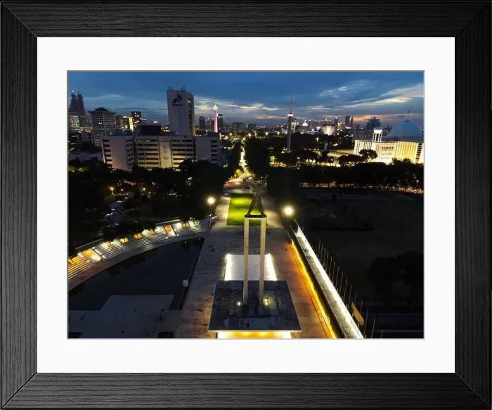 Framed Print : Aerial view of West Irian Liberation monument in downtown Jakarta and noise cloud when sunset with Jakarta cityscape Framed Print : Aerial view of West Irian Liberation monument in downtown Jakarta and noise cloud when sunset with Jakarta cityscape