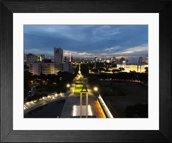 Framed Print : Aerial view of West Irian Liberation monument in downtown Jakarta and noise cloud when sunset with Jakarta cityscape Framed Print : Aerial view of West Irian Liberation monument in downtown Jakarta and noise cloud when sunset with Jakarta cityscape