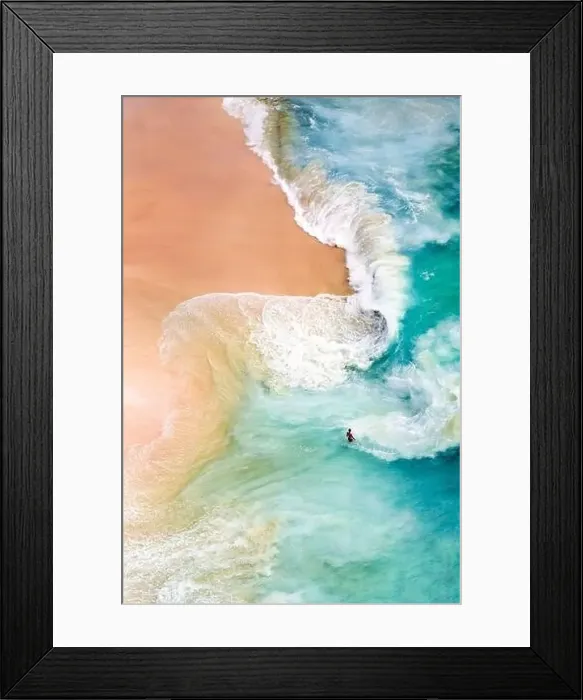 Framed Print : View from above, stunning aerial view of a person relaxing on a beautiful beach bathed by a turquoise sea during sunset Framed Print : View from above, stunning aerial view of a person relaxing on a beautiful beach bathed by a turquoise sea during sunset