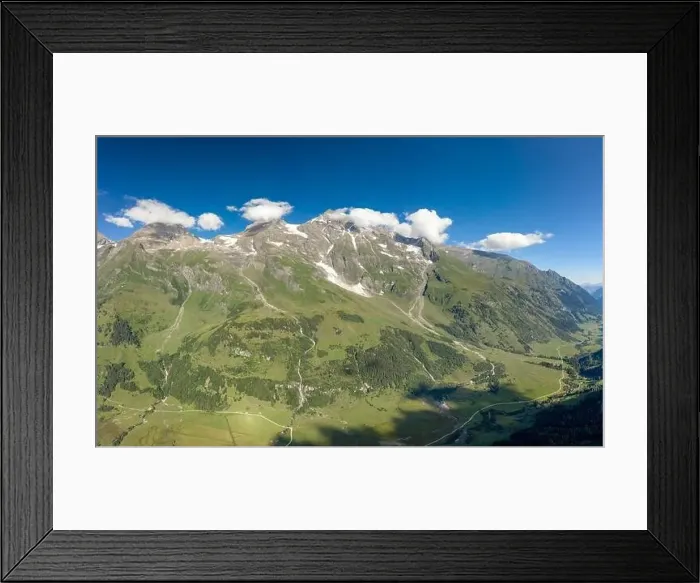 Framed Print : Aerial drone shot of Grossglockner mountain range valley in summer in Austria Framed Print : Aerial drone shot of Grossglockner mountain range valley in summer in Austria