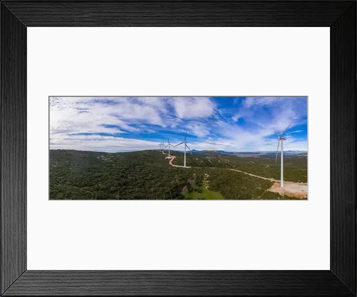 Framed Print : Wind farm panorama. Wind turbines and curvy road on the hill Framed Print : Wind farm panorama. Wind turbines and curvy road on the hill