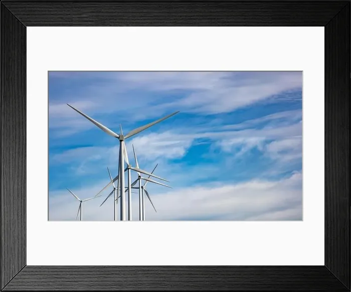 Framed Print : Wind turbines on blue cloudy sky background Framed Print : Wind turbines on blue cloudy sky background