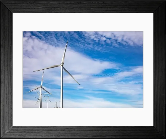 Framed Print : Wind turbines on blue cloudy sky background Framed Print : Wind turbines on blue cloudy sky background