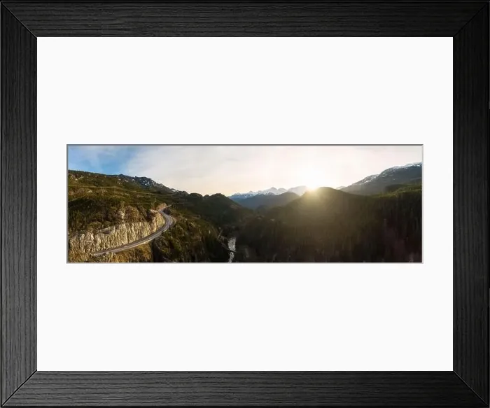 Framed Print : Aerial drone view of Sea to Sky Highway during a bright winter sunset Framed Print : Aerial drone view of Sea to Sky Highway during a bright winter sunset